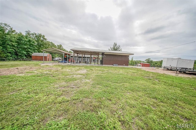 14901 State Route Ff, Edgar Springs, MO 65462 - view of green lawn with a carport and a storage shed