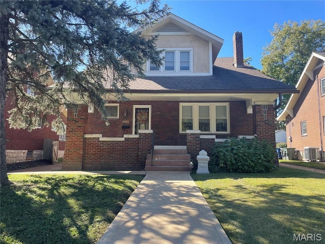 3670 Loughborough Ave, Saint Louis, MO 63116 - view of front of home featuring a chimney, a front yard, brick siding, and roof with shingles