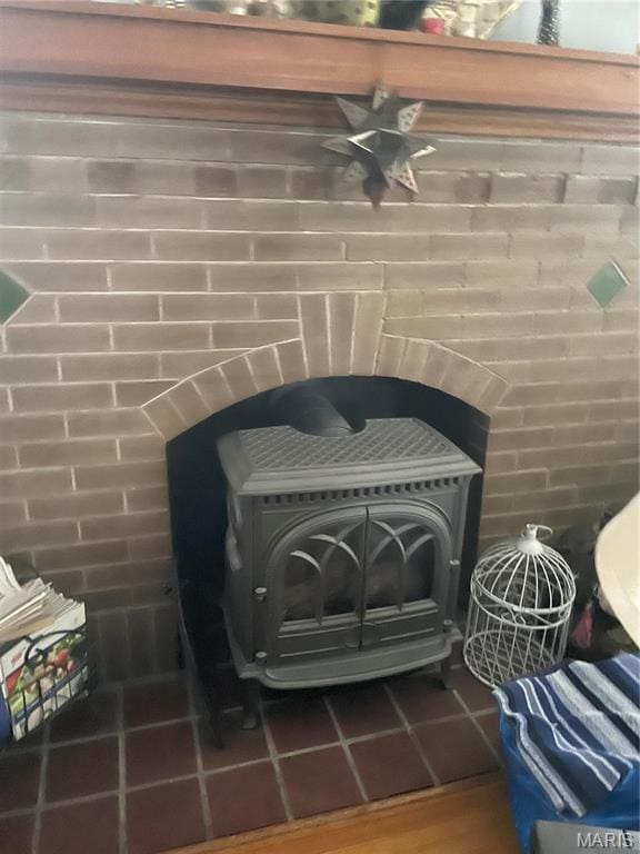 3670 Loughborough Ave, Saint Louis, MO 63116 - detailed view of a wood stove and a ceiling fan