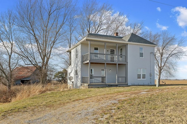 7097 State Route 3, Evansville, IL 62242 - rear view of property featuring a balcony, a chimney, and a yard
