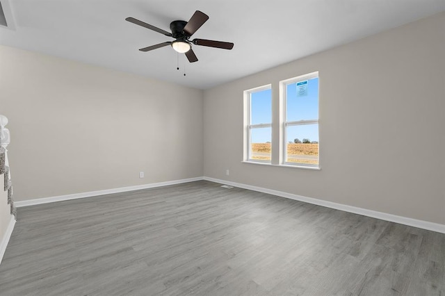 7097 State Route 3, Evansville, IL 62242 - spare room featuring baseboards, wood finished floors, and ceiling fan