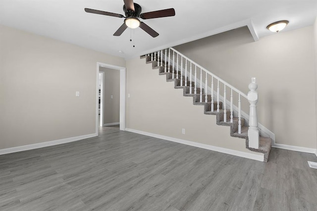 7097 State Route 3, Evansville, IL 62242 - stairs featuring a ceiling fan, wood finished floors, and baseboards