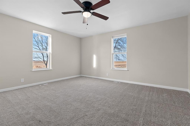 7097 State Route 3, Evansville, IL 62242 - unfurnished room featuring ceiling fan, baseboards, and carpet floors