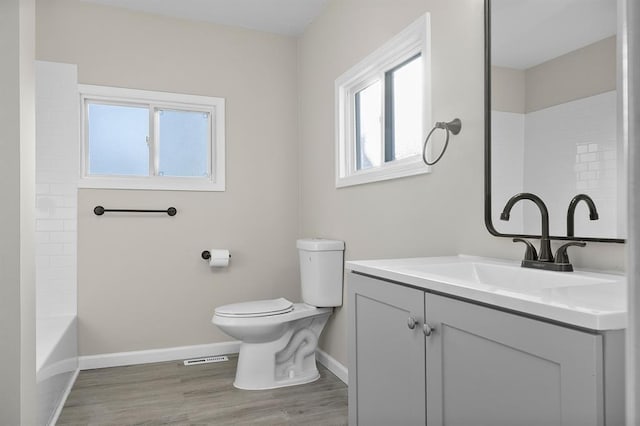 7097 State Route 3, Evansville, IL 62242 - bathroom featuring vanity, baseboards, wood finished floors, toilet, and shower / washtub combination