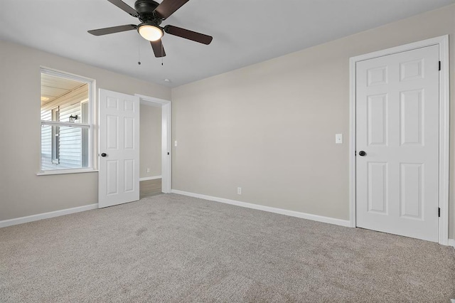 7097 State Route 3, Evansville, IL 62242 - unfurnished bedroom featuring carpet, baseboards, and ceiling fan
