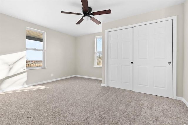 7097 State Route 3, Evansville, IL 62242 - unfurnished bedroom featuring carpet floors, a closet, baseboards, and a ceiling fan