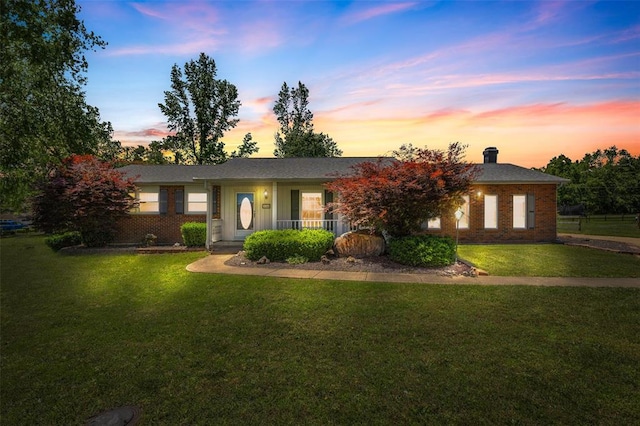 114 Fairlane Dr, Ironton, MO 63650 - ranch-style house with brick siding, a yard, and a chimney