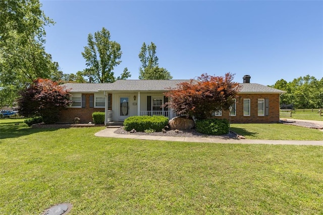 114 Fairlane Dr, Ironton, MO 63650 - single story home with a front lawn, brick siding, covered porch, and a chimney