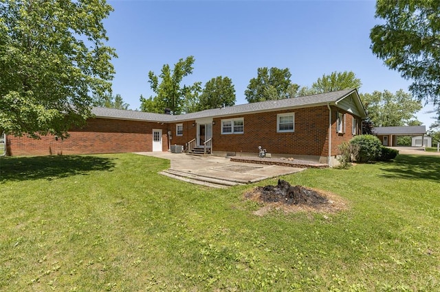 114 Fairlane Dr, Ironton, MO 63650 - back of property featuring entry steps, a patio area, brick siding, and a yard