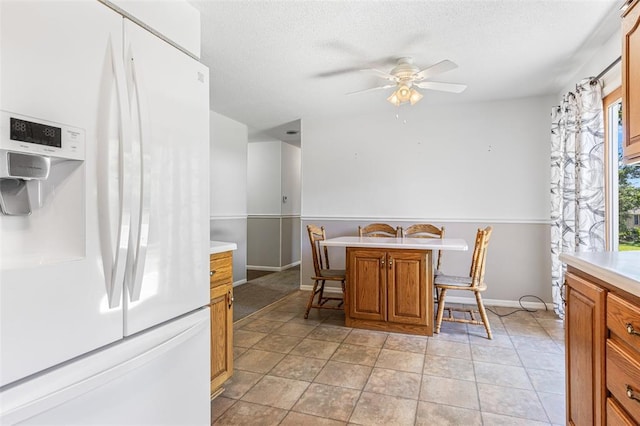 114 Fairlane Dr, Ironton, MO 63650 - dining area featuring a ceiling fan, baseboards, and a textured ceiling