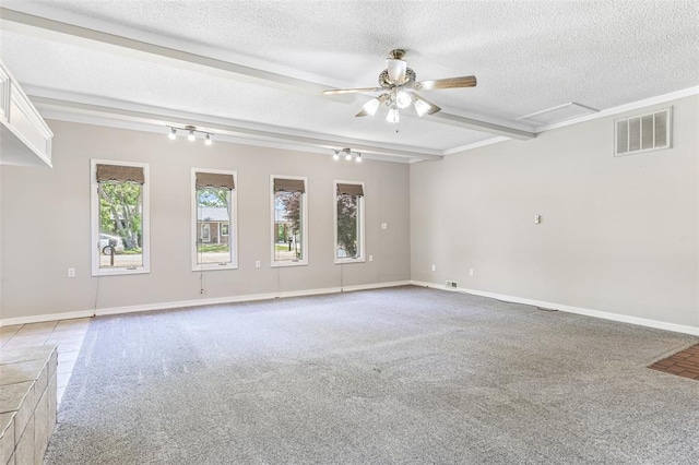 114 Fairlane Dr, Ironton, MO 63650 - empty room featuring beamed ceiling, a textured ceiling, a ceiling fan, attic access, and carpet floors
