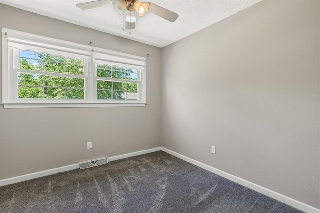 114 Fairlane Dr, Ironton, MO 63650 - unfurnished room with healthy amount of natural light, dark colored carpet, a ceiling fan, and baseboards