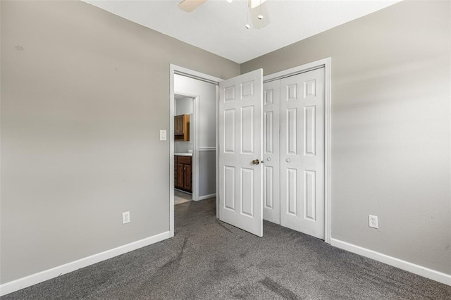 114 Fairlane Dr, Ironton, MO 63650 - unfurnished bedroom featuring dark carpet, baseboards, a closet, and a ceiling fan