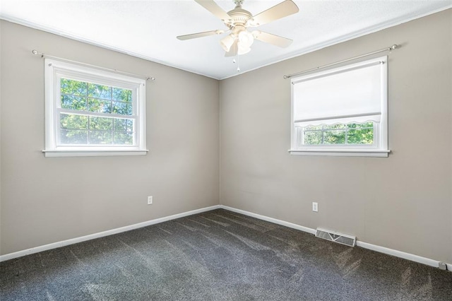 114 Fairlane Dr, Ironton, MO 63650 - empty room featuring plenty of natural light, dark colored carpet, and baseboards