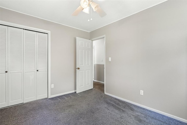 114 Fairlane Dr, Ironton, MO 63650 - unfurnished bedroom featuring dark colored carpet, baseboards, a closet, and ceiling fan