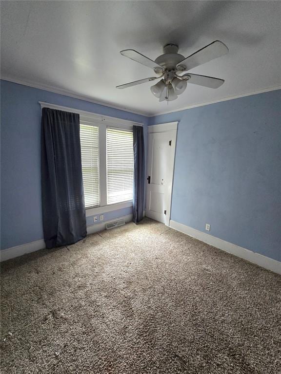 523 E Acton Ave, Wood River, IL 62095 - carpeted empty room featuring ornamental molding, ceiling fan, and baseboards