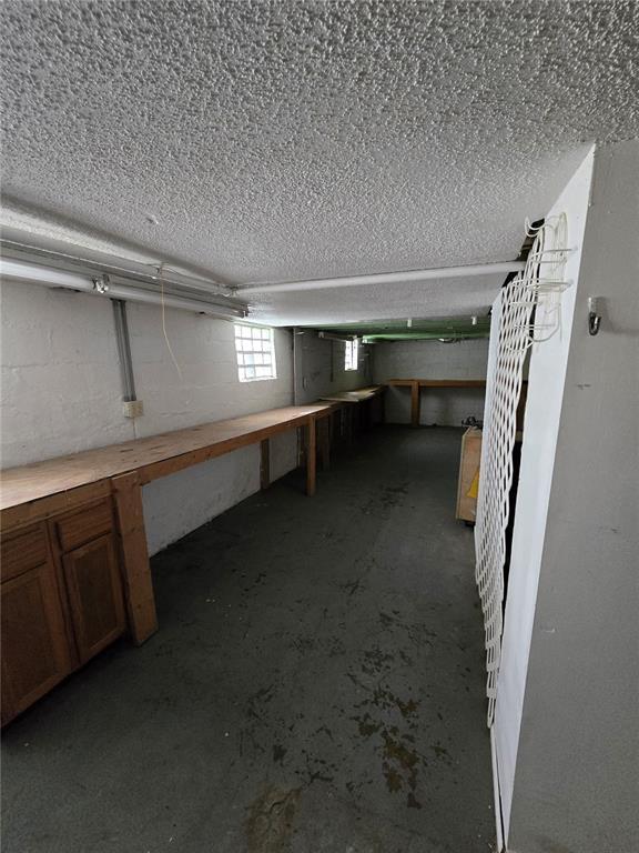 523 E Acton Ave, Wood River, IL 62095 - below grade area featuring a textured ceiling