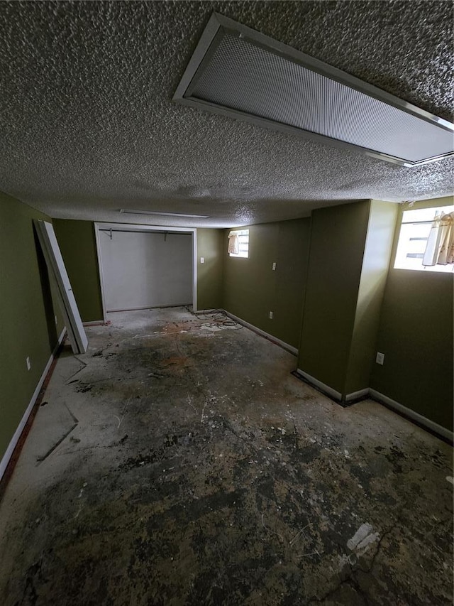 523 E Acton Ave, Wood River, IL 62095 - below grade area featuring healthy amount of natural light and baseboards