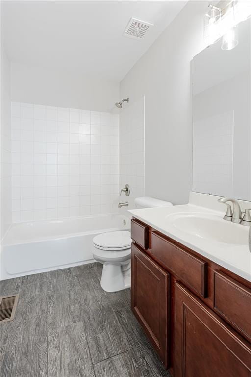 614 Palisades View Dr, Eureka, MO 63025 - full bathroom featuring vanity, toilet,  shower combination, and wood finished floors