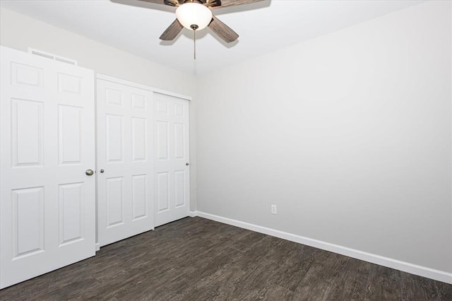 614 Palisades View Dr, Eureka, MO 63025 - unfurnished bedroom with dark wood finished floors, a closet, baseboards, and ceiling fan