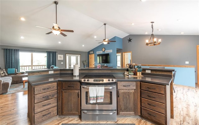 19285 State Route Ee, St James, MO 65559 - kitchen with open floor plan, stainless steel range with gas stovetop, dark countertops, a ceiling fan, and vaulted ceiling
