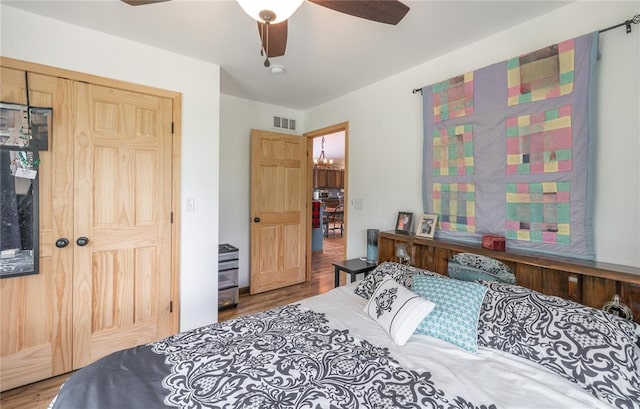 19285 State Route Ee, St James, MO 65559 - bedroom featuring wood finished floors, a ceiling fan, and a closet