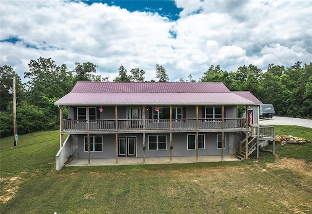 19285 State Route Ee, St James, MO 65559 - rear view of house with a lawn, metal roof, a patio area, and a wooden deck