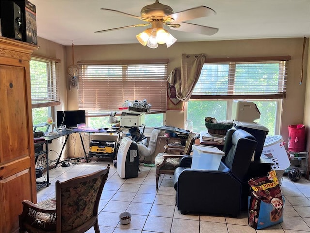 12241 Pipeline Rd, Bourbon, MO 65441 - living area with a ceiling fan, light tile patterned floors, and a desk