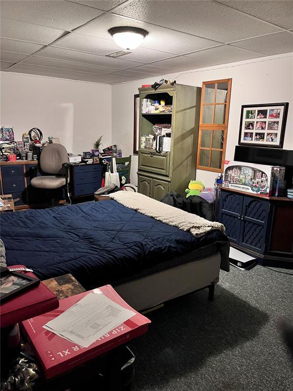 12241 Pipeline Rd, Bourbon, MO 65441 - bedroom featuring a drop ceiling and carpet flooring