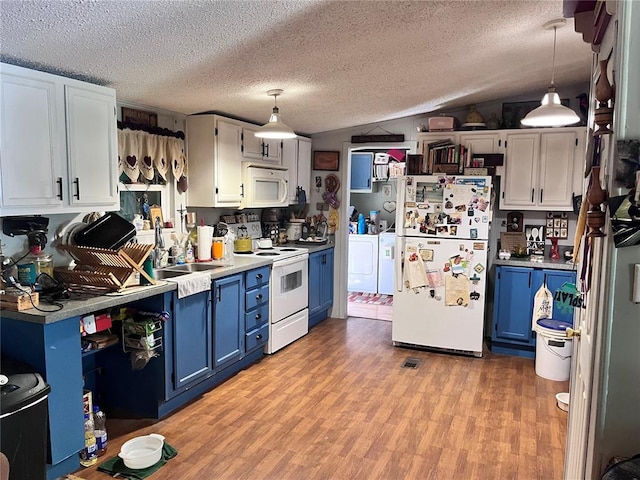 12241 Pipeline Rd, Bourbon, MO 65441 - kitchen featuring white appliances, blue cabinetry, separate washer and dryer, a sink, and light countertops