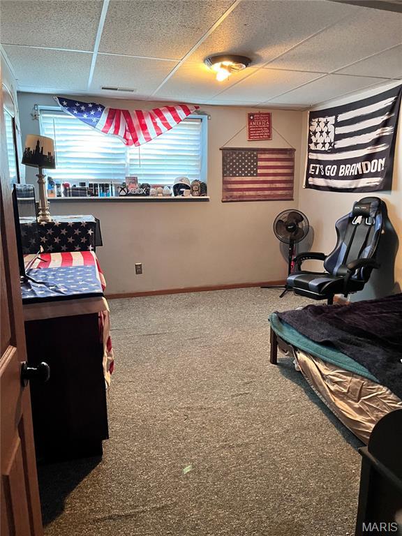 12241 Pipeline Rd, Bourbon, MO 65441 - recreation room with a paneled ceiling and carpet flooring