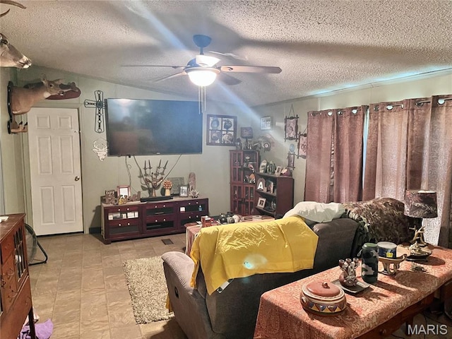 12241 Pipeline Rd, Bourbon, MO 65441 - living room featuring a ceiling fan, a textured ceiling, vaulted ceiling, and tile patterned floors