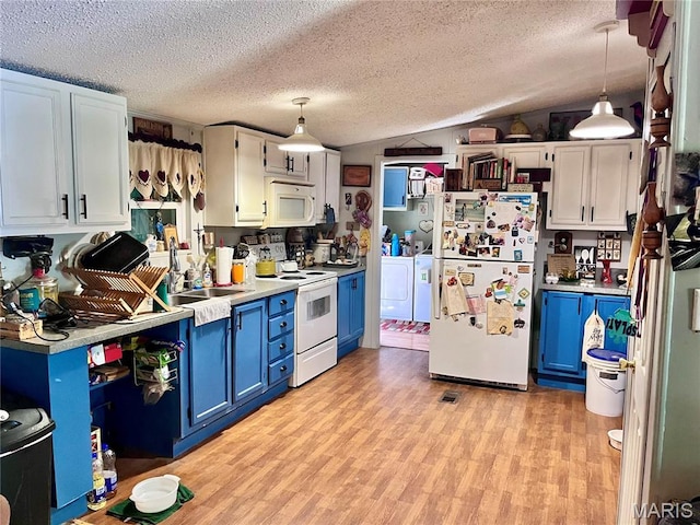 12241 Pipeline Rd, Bourbon, MO 65441 - kitchen featuring white appliances, blue cabinetry, washer and clothes dryer, light wood finished floors, and light countertops