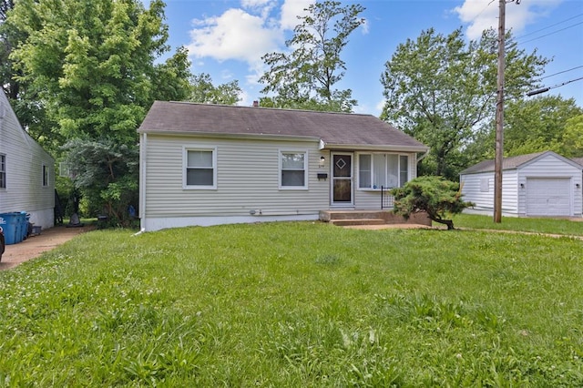 270 Estridge Rd, Saint Louis, MO 63137 - view of front of home featuring a front yard, an outbuilding, and a detached garage