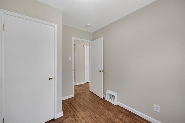 270 Estridge Rd, Saint Louis, MO 63137 - unfurnished bedroom with baseboards and wood finished floors