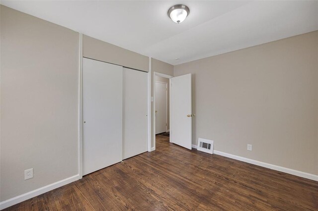270 Estridge Rd, Saint Louis, MO 63137 - unfurnished bedroom with wood finished floors, baseboards, and a closet