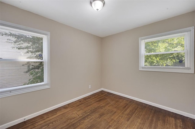 270 Estridge Rd, Saint Louis, MO 63137 - unfurnished room with baseboards and dark wood-style flooring