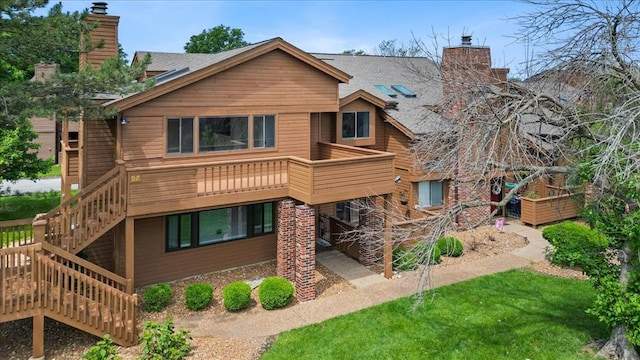 321 Kipling Way Unit G, Weldon Spring, MO 63304 - back of property with a chimney, stairway, and a wooden deck