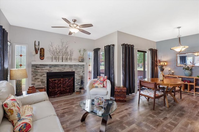 321 Kipling Way Unit G, Weldon Spring, MO 63304 - living area with wood finished floors, ceiling fan, and a stone fireplace