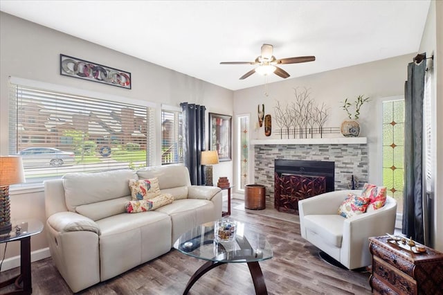 321 Kipling Way Unit G, Weldon Spring, MO 63304 - living room with a ceiling fan, healthy amount of natural light, wood finished floors, and a stone fireplace