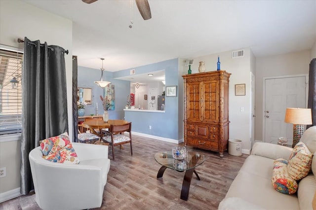 321 Kipling Way Unit G, Weldon Spring, MO 63304 - living room featuring wood finished floors, a ceiling fan, and baseboards