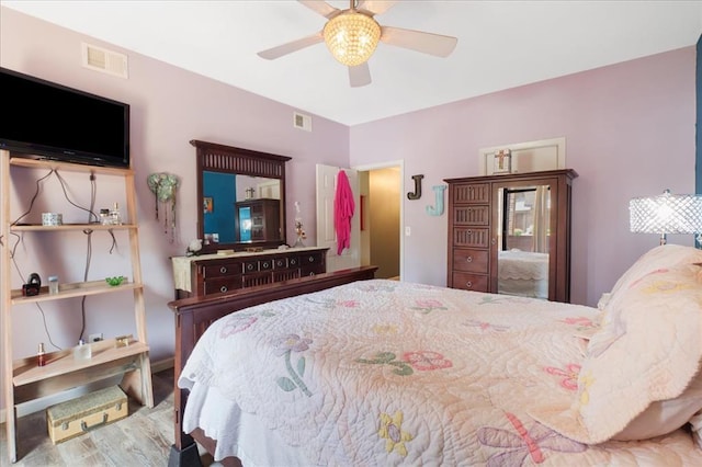 321 Kipling Way Unit G, Weldon Spring, MO 63304 - bedroom with wood finished floors, ceiling fan, and baseboards