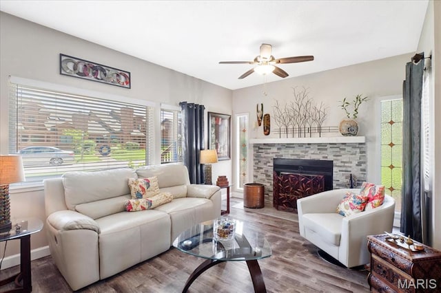 321 Kipling Way Unit G, Weldon Spring, MO 63304 - living area featuring ceiling fan, healthy amount of natural light, wood finished floors, and a stone fireplace