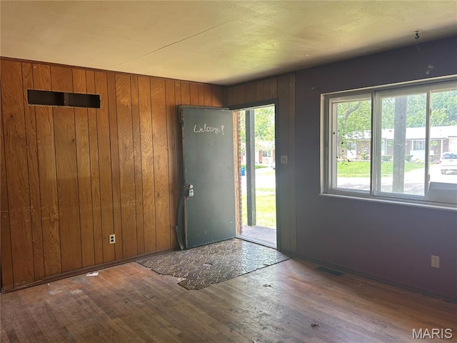 11214 Terry Ave, Bridgeton, MO 63044 - entryway featuring wood finished floors, wooden walls, and baseboards