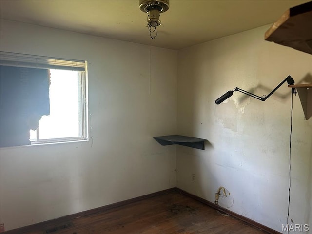 11214 Terry Ave, Bridgeton, MO 63044 - spare room with dark wood-style floors and baseboards