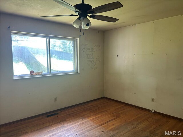 11214 Terry Ave, Bridgeton, MO 63044 - spare room with wood finished floors, baseboards, and a ceiling fan