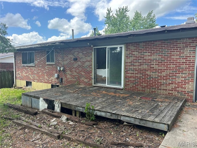 11214 Terry Ave, Bridgeton, MO 63044 - rear view of house featuring brick siding and a wooden deck