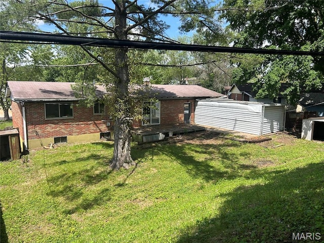 11214 Terry Ave, Bridgeton, MO 63044 - rear view of house with brick siding, a yard, and a shingled roof