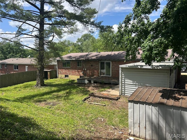11214 Terry Ave, Bridgeton, MO 63044 - rear view of house with an outdoor structure, brick siding, and an attached garage