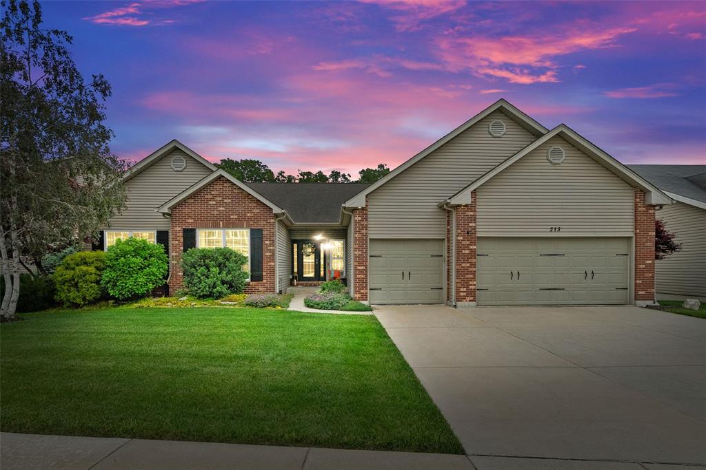 213 Carlton Point Dr, Wentzville, MO 63385 - single story home with a garage, concrete driveway, a yard, and brick siding